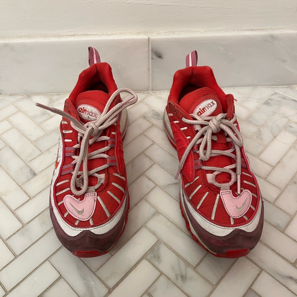 Pink and red Nike air max